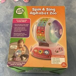 NIB. Spin & Sing Alphabet Zoo - Pink/White Educational Ball Toy